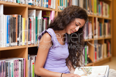 Young student reading a book