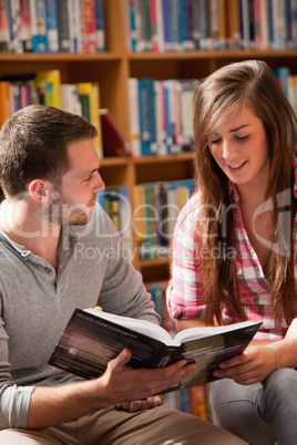 Portrait of students reading a book