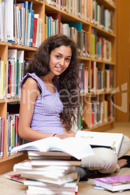 Portrait of a happy student with a book