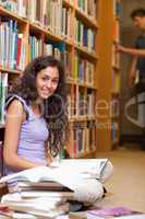 Portrait of a young female student with a book