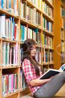 Portrait of a young female student reading a book