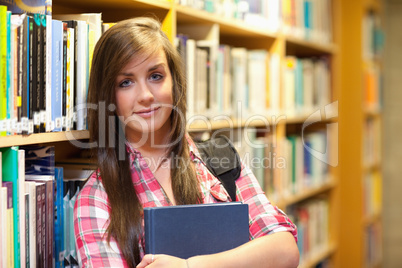 Calm female student posing