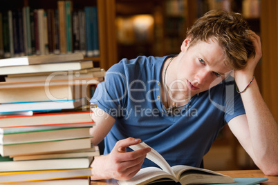 Tired man with a book