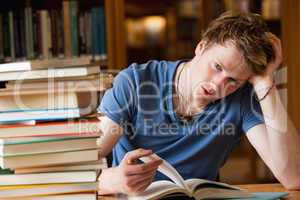 Tired man with a book