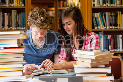 Serious students looking at a book