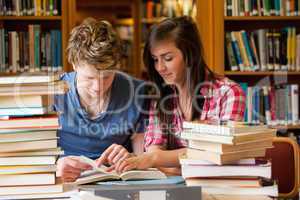 Serious students looking at a book