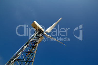The wind generator against the blue sky