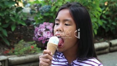 Young Asian Girl Eating Ice Cream Cone