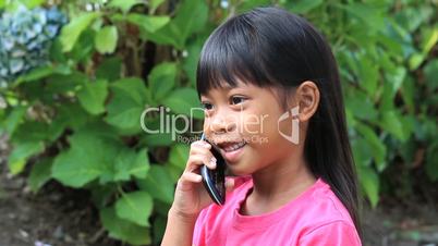 Little Girl Talking On Cell Phone