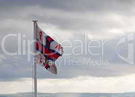 RLNI Flag on cloudy day