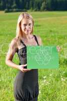 Green energy young businesswoman hold recycle sign