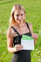 Surprise envelope young businesswoman sunny meadow