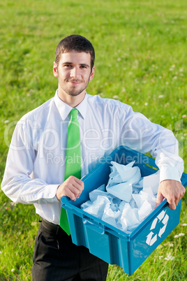 Recycling paper box businessman in sunny meadow