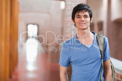 Smiling male student posing