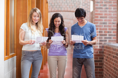 Students reading a piece of paper