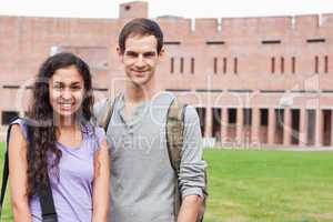 Smiling student couple posing