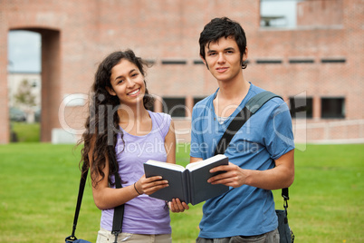 Couple holding a book