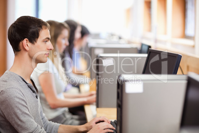 Male student using a computer