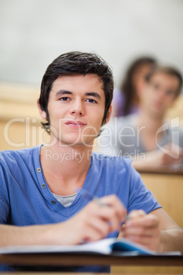 Portrait of a student listening to a lecturer