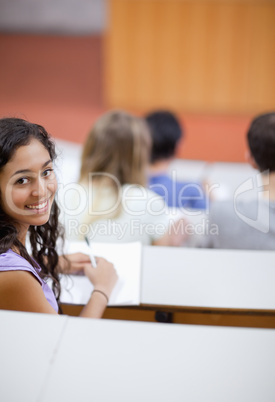 Portrait of a cute student being distracted