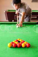 Portrait of a man playing snooker