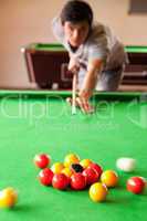 Portrait of a man starting a pool game