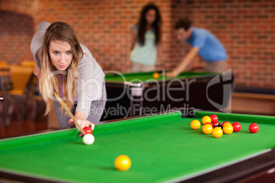 Woman playing snooker