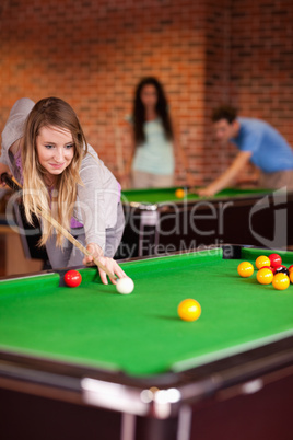 Portrait of a woman playing snooker