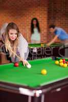 Portrait of a woman playing snooker