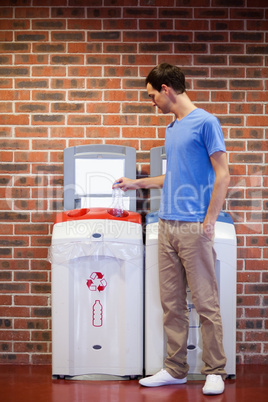 Portrait of a young man recycling