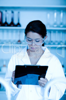 Portrait of a scientist taking notes