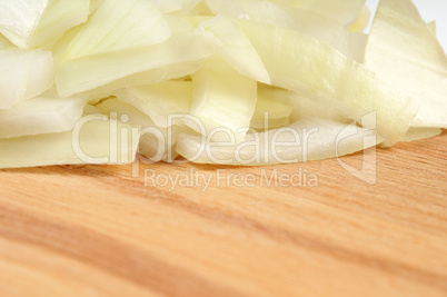 Chopped onions on a wooden board
