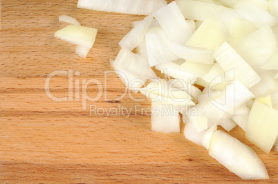 Chopped onions on a wooden board