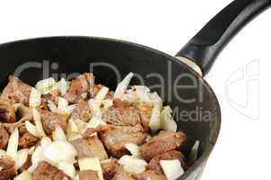 Roasting pan with Meat and onion.