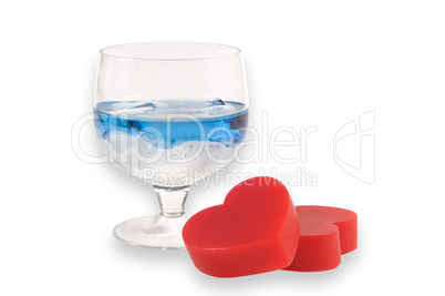 A two glasses of liqueur with two hearts.