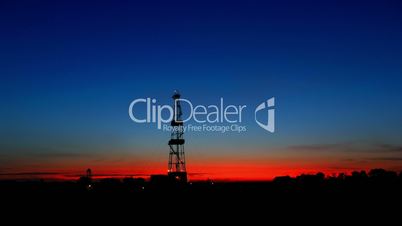 timelapse drilling rig silhouette