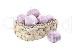 Several garlic in a wicker basket