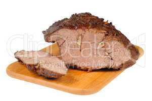 Roast beef on a wooden board