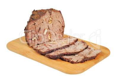 Roast beef on a wooden board