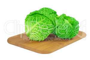 Savoy cabbage on a wooden board
