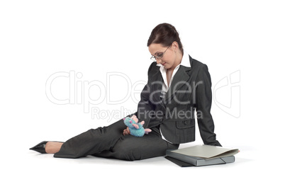 Young business woman playing with a toy