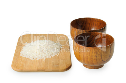Wooden bowls for rice. Handful of rice