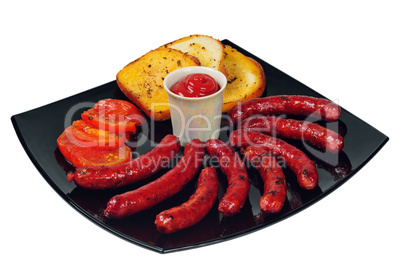 Plate with grilled sausages and ketchup