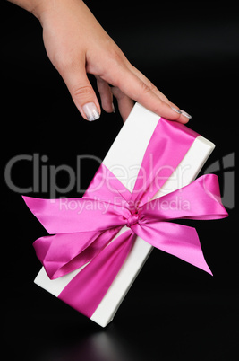 Gift box with and woman's hand