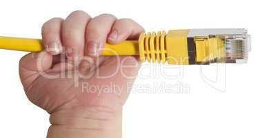 baby holding yellow network plug