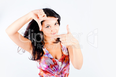 Girl with frame gesture. Focus on fingers