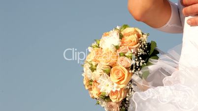 Newlyweds with a bouquet