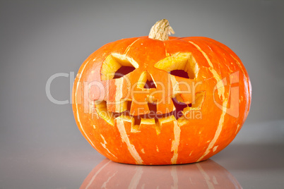 halloween, old jack-o-lantern on grey