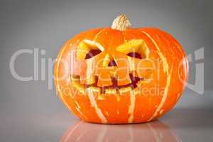 halloween, old jack-o-lantern on grey