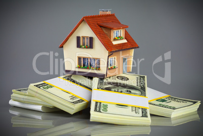 house on packs of banknotes